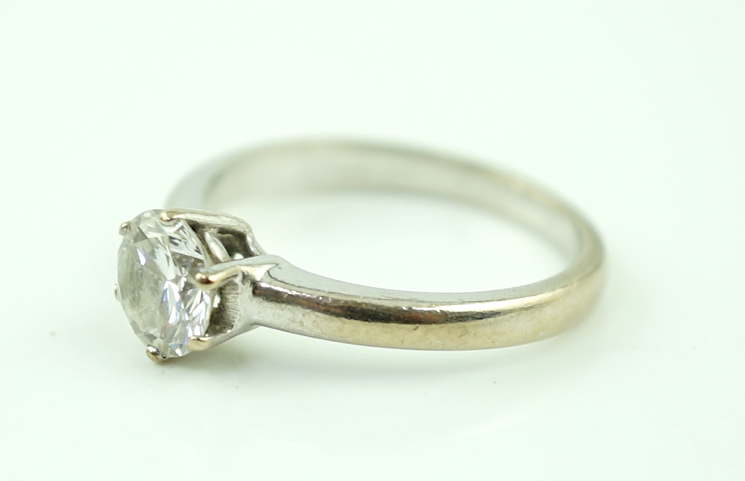 A modern 18ct white gold and solitaire diamond ring